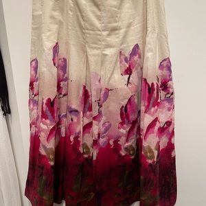 Multi-color, floral pattern cotton skirt. Cream color lining. Side zipper.